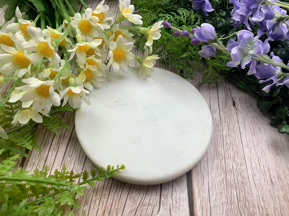 a white plate with flowers on it