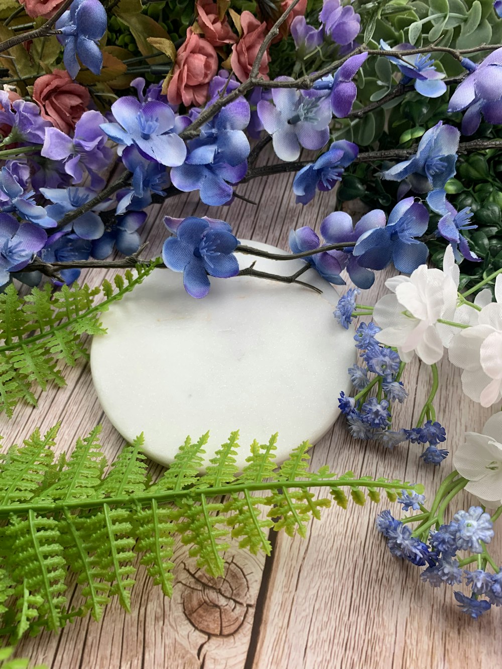 a white cake with blue flowers on it