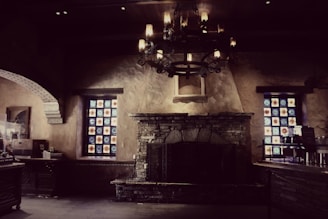 Inviting interior of villa with rustic stone walls and cozy fireplace.