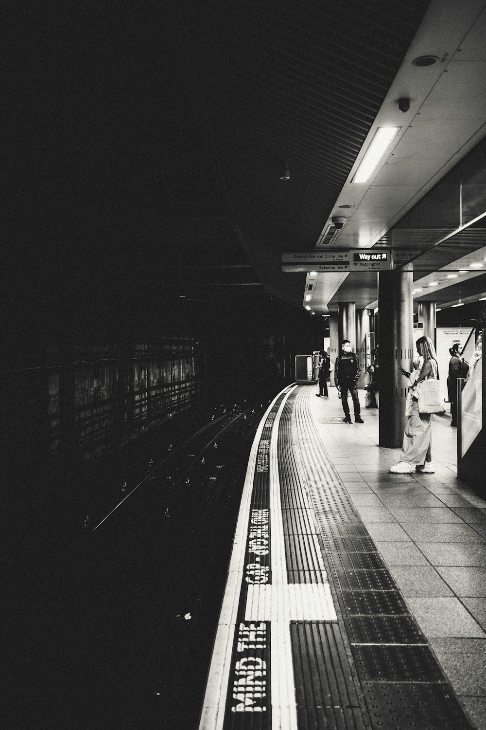 people waiting at a train station