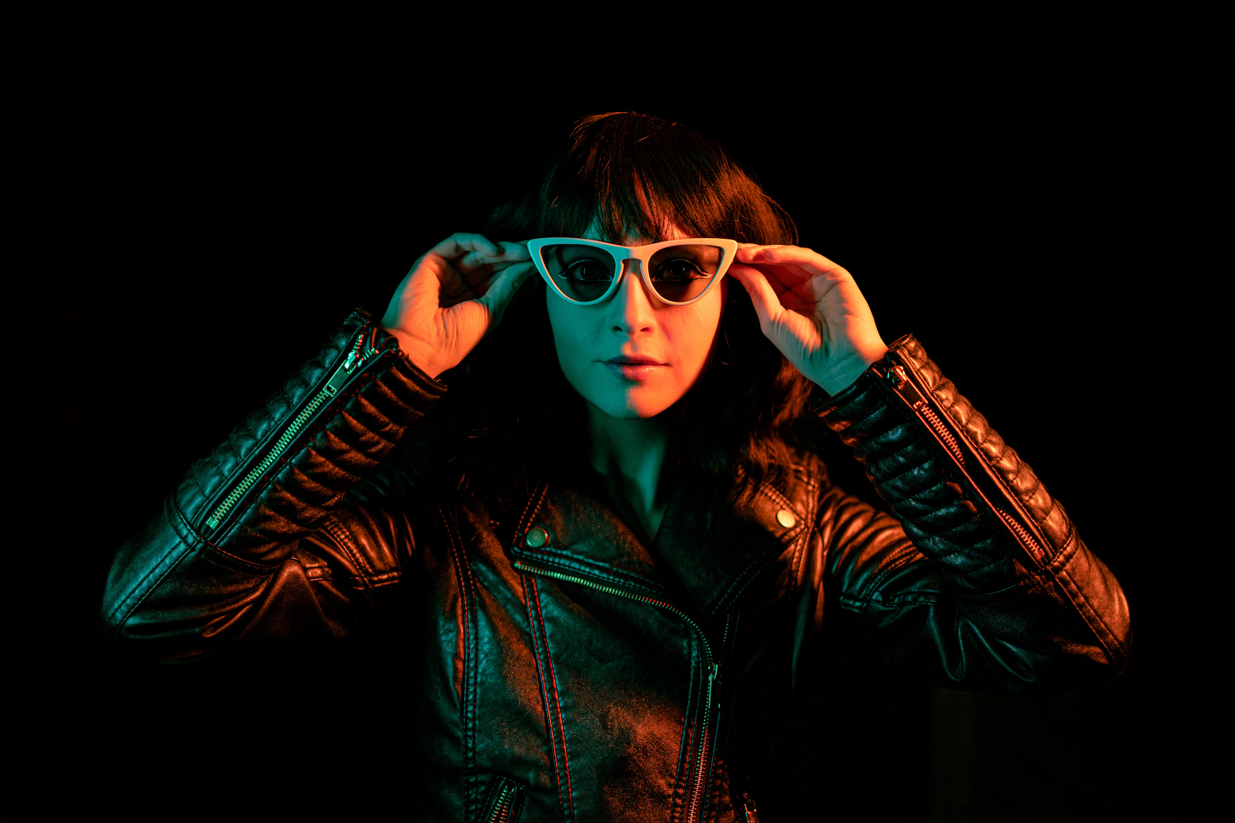 Portrait lit in red and teal