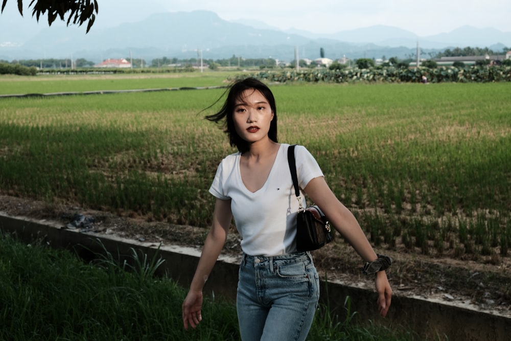 a woman standing in a field