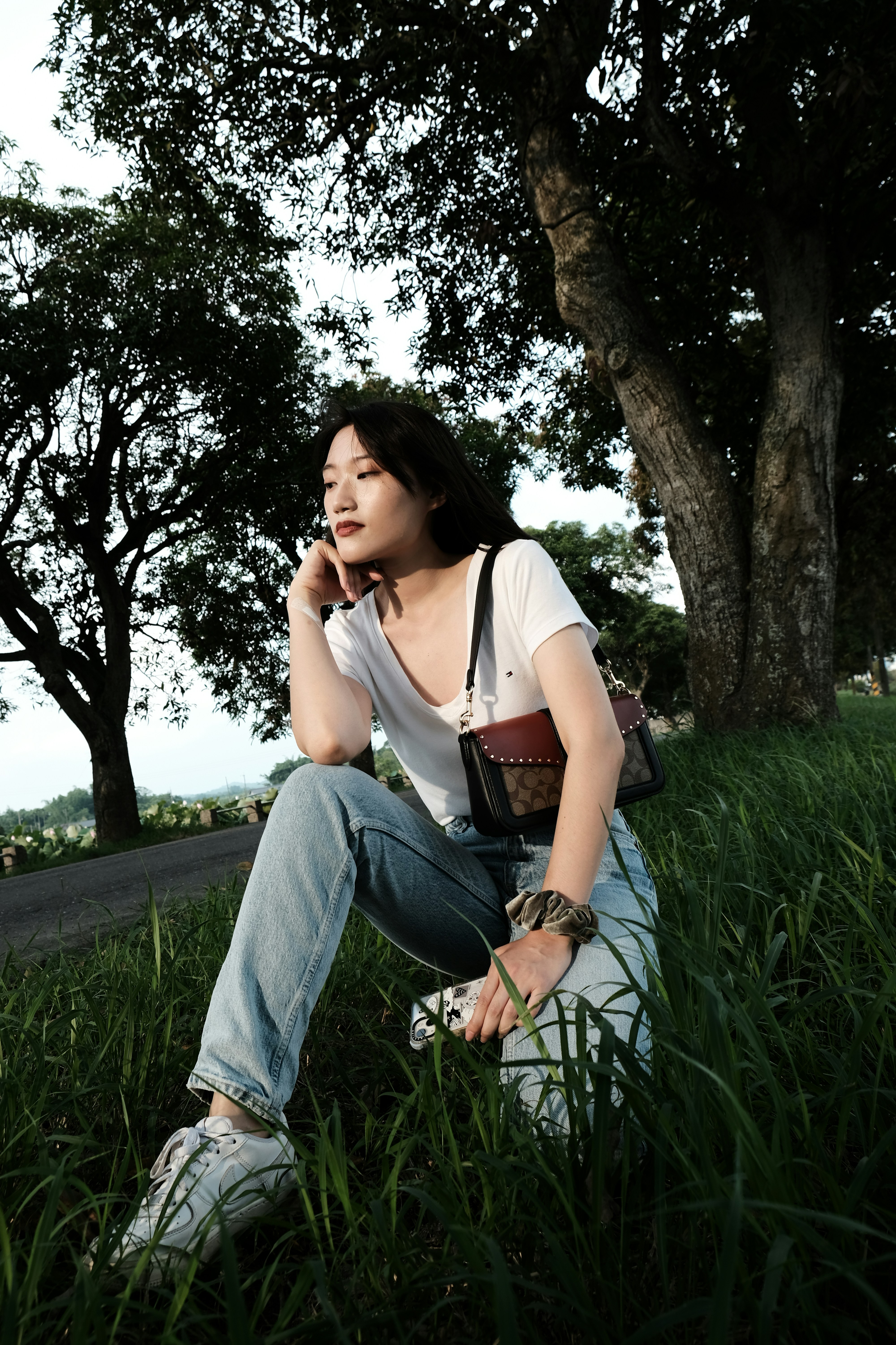 a person sitting in the grass