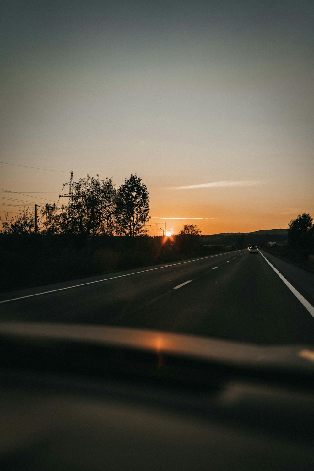 a road with trees on the side