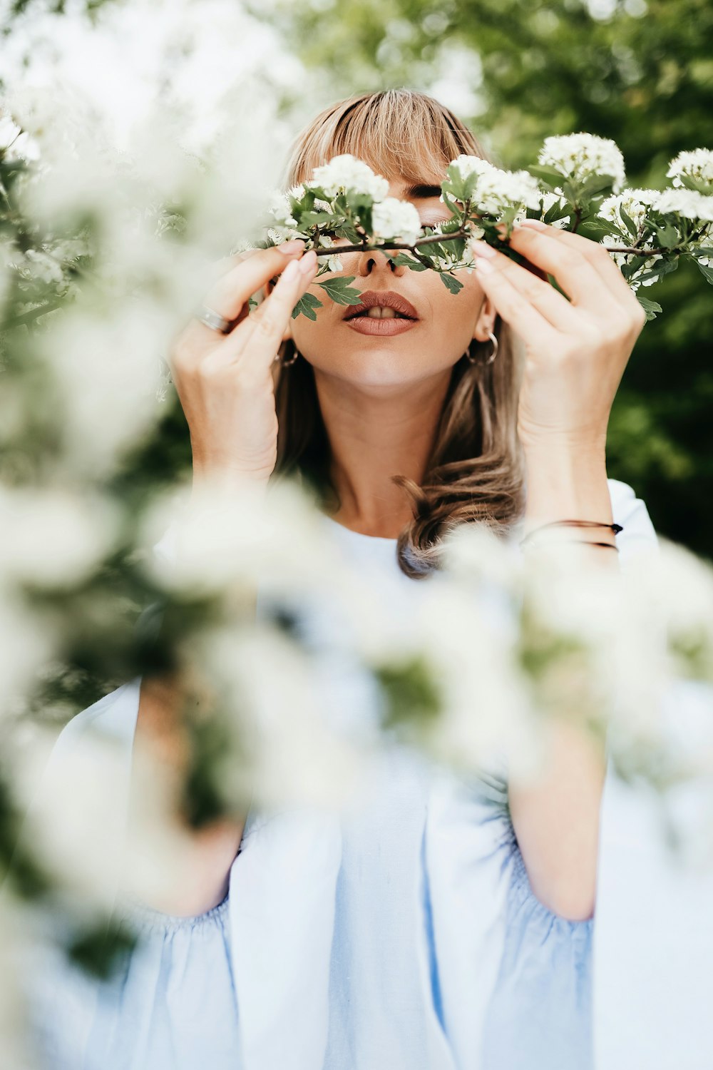 a woman holding flowers