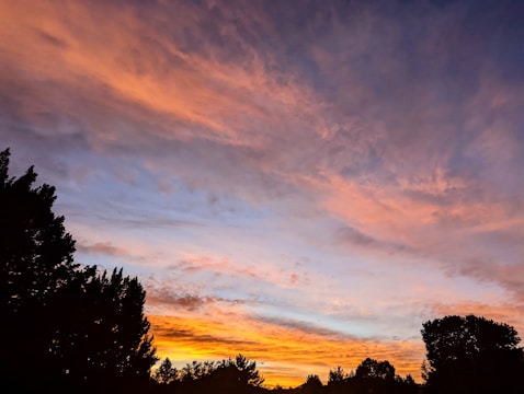 A cinematic frame showing a dramatic sunset scene edited with vibrant colors.