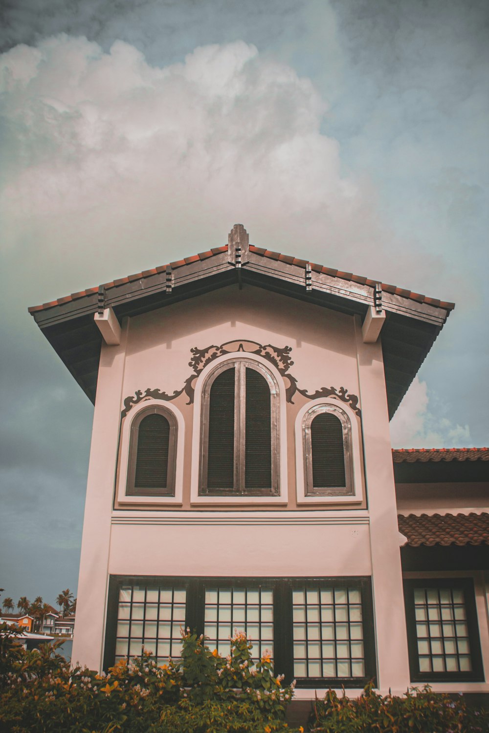 a white building with a red roof