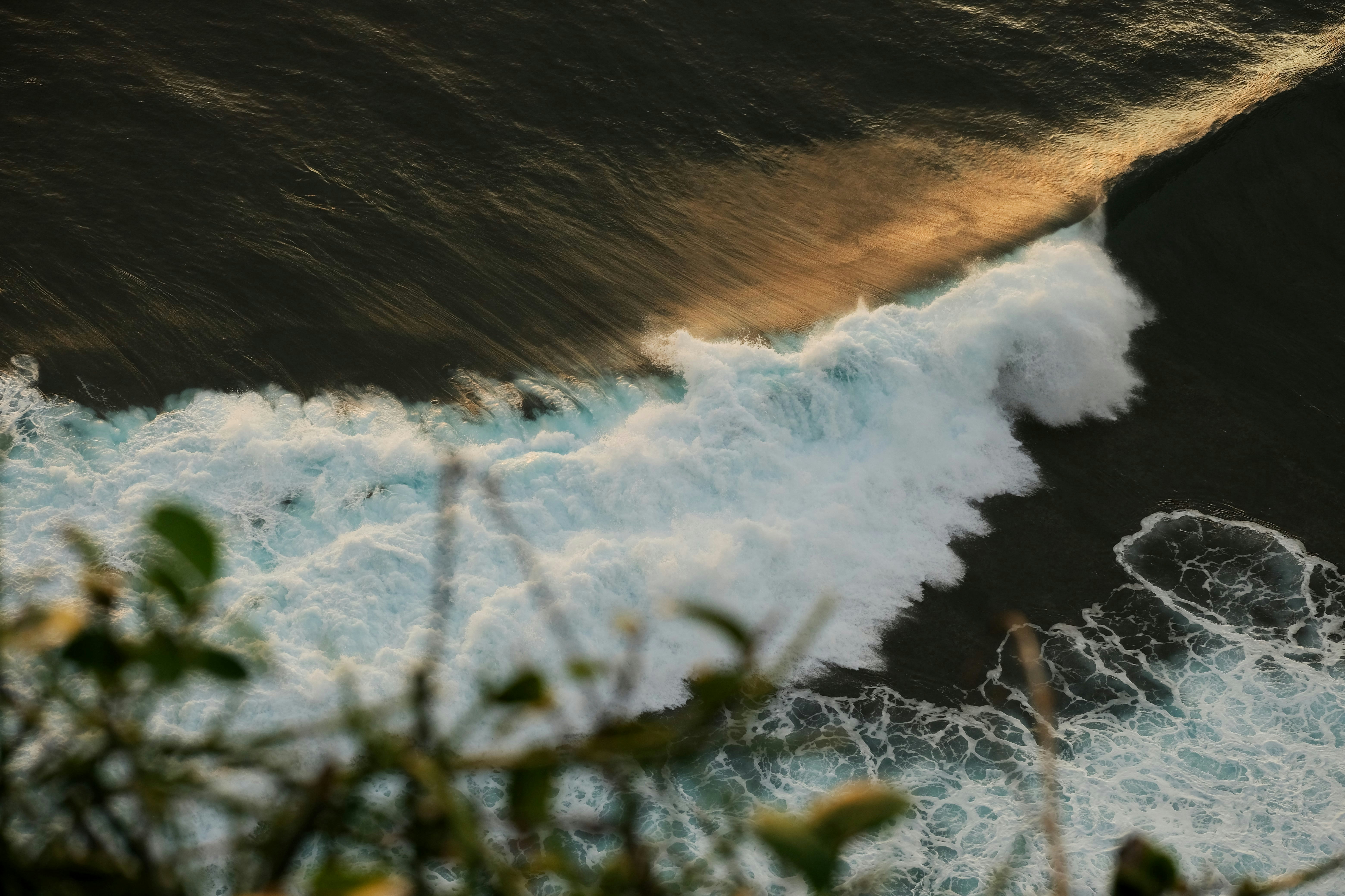 a wave crashing on a beach