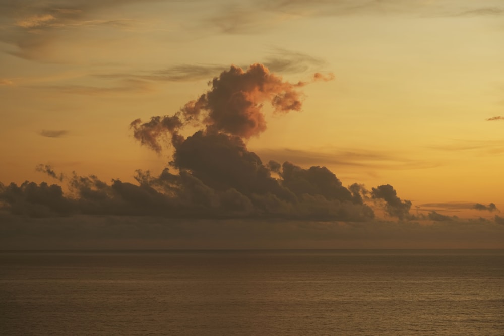 a body of water with smoke coming out of it