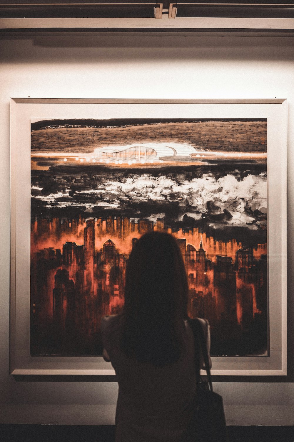 a person looking at a painting