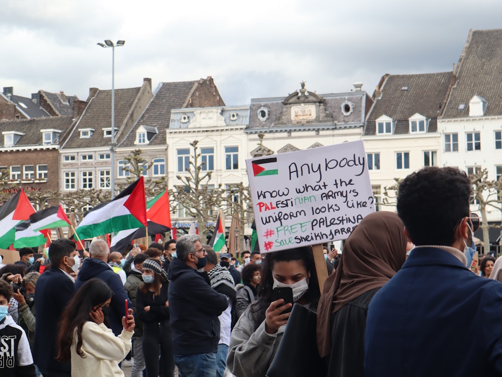 a group of people holding a sign