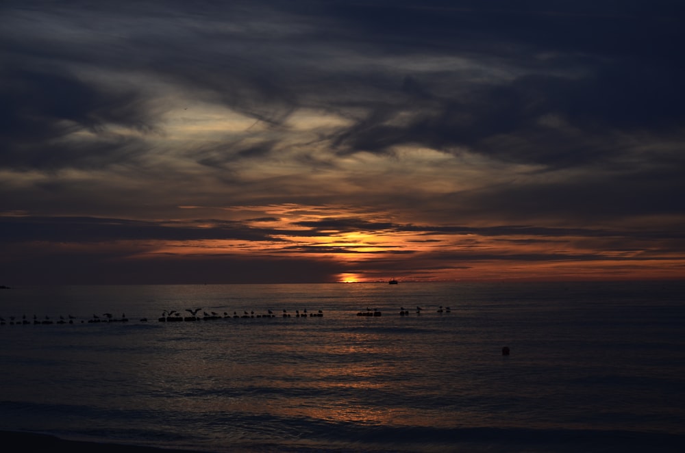 a sunset over a body of water