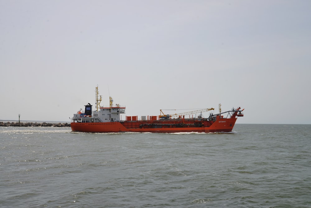 a large red and white ship