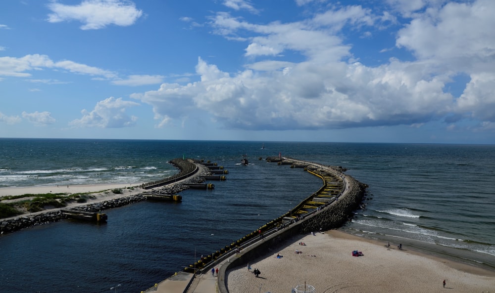 a long dock going into the ocean