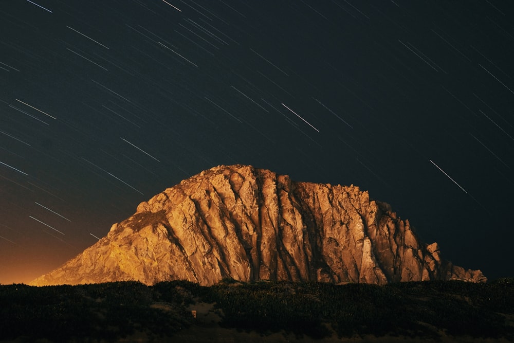 a mountain with a starry sky above it