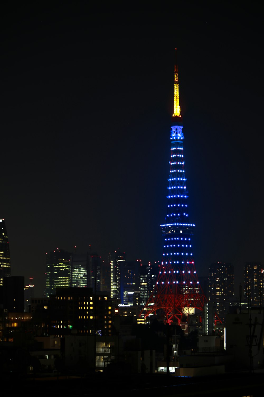 a tall building lit up at night