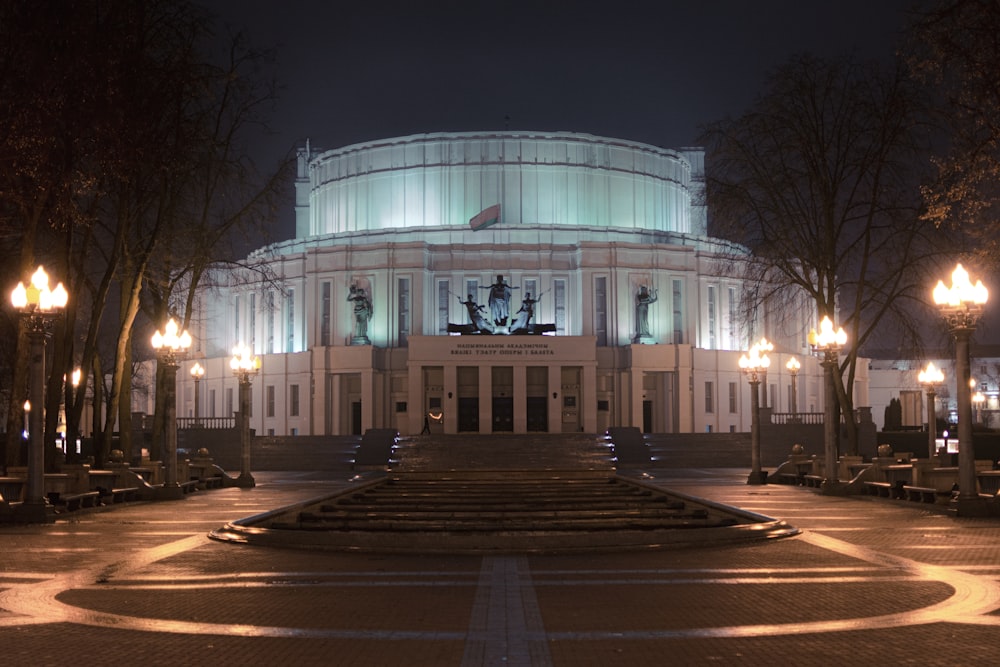 a large white building with a glass front