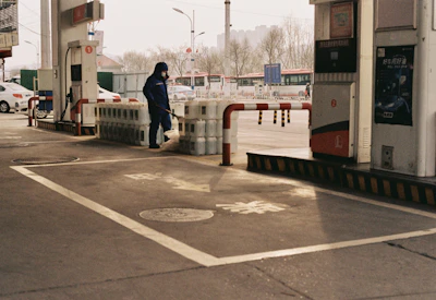 Close-up of a technician checking fuel infrastructure safety equipment with precision.