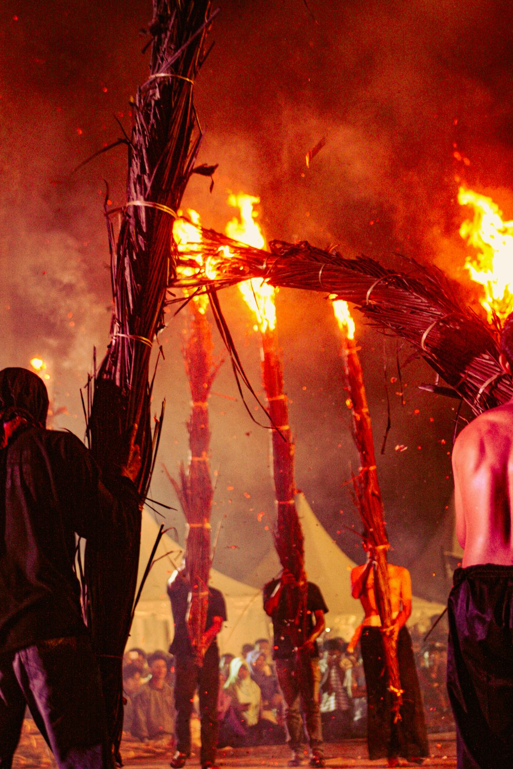 a group of people watching a fire