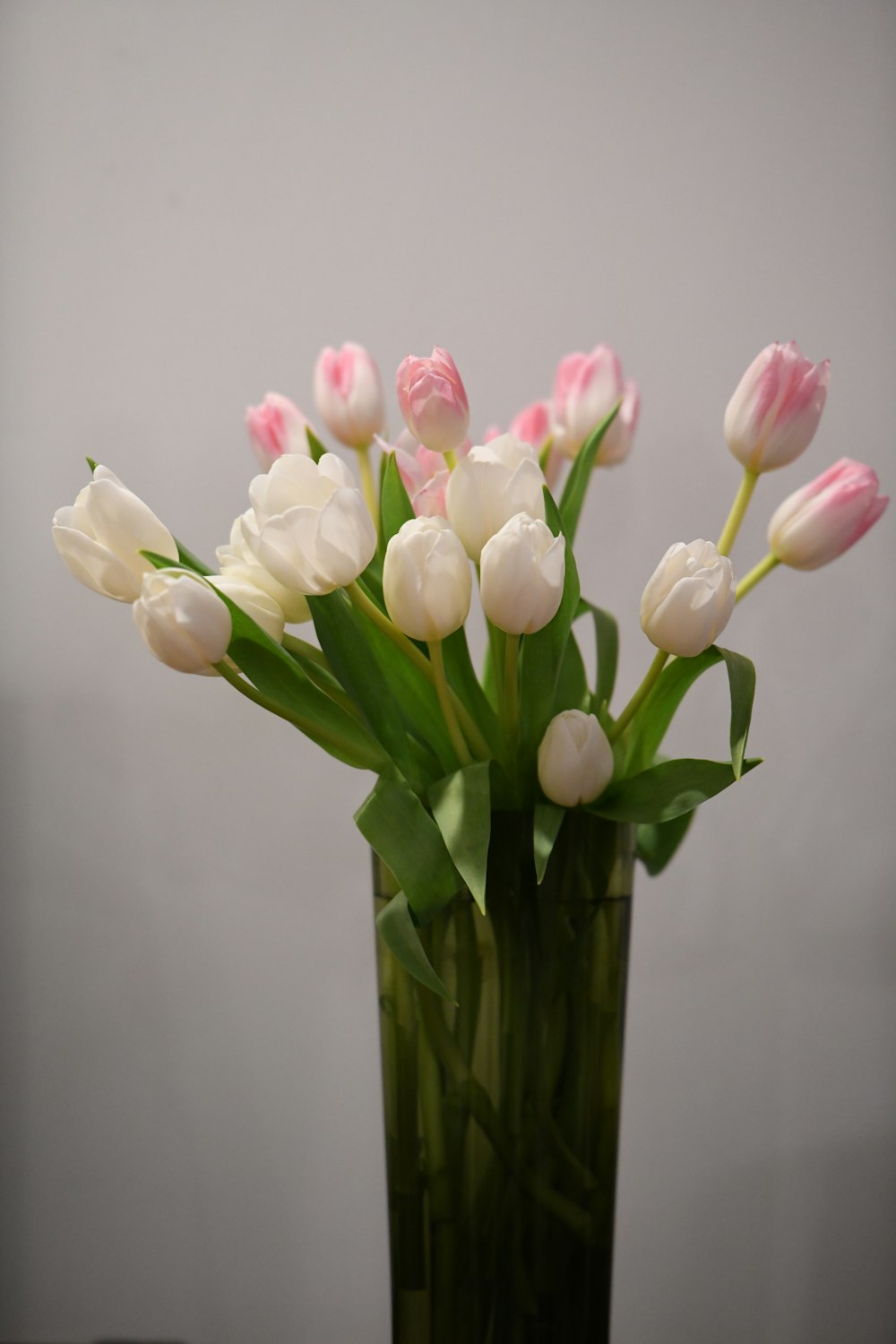 a vase with pink and white flowers