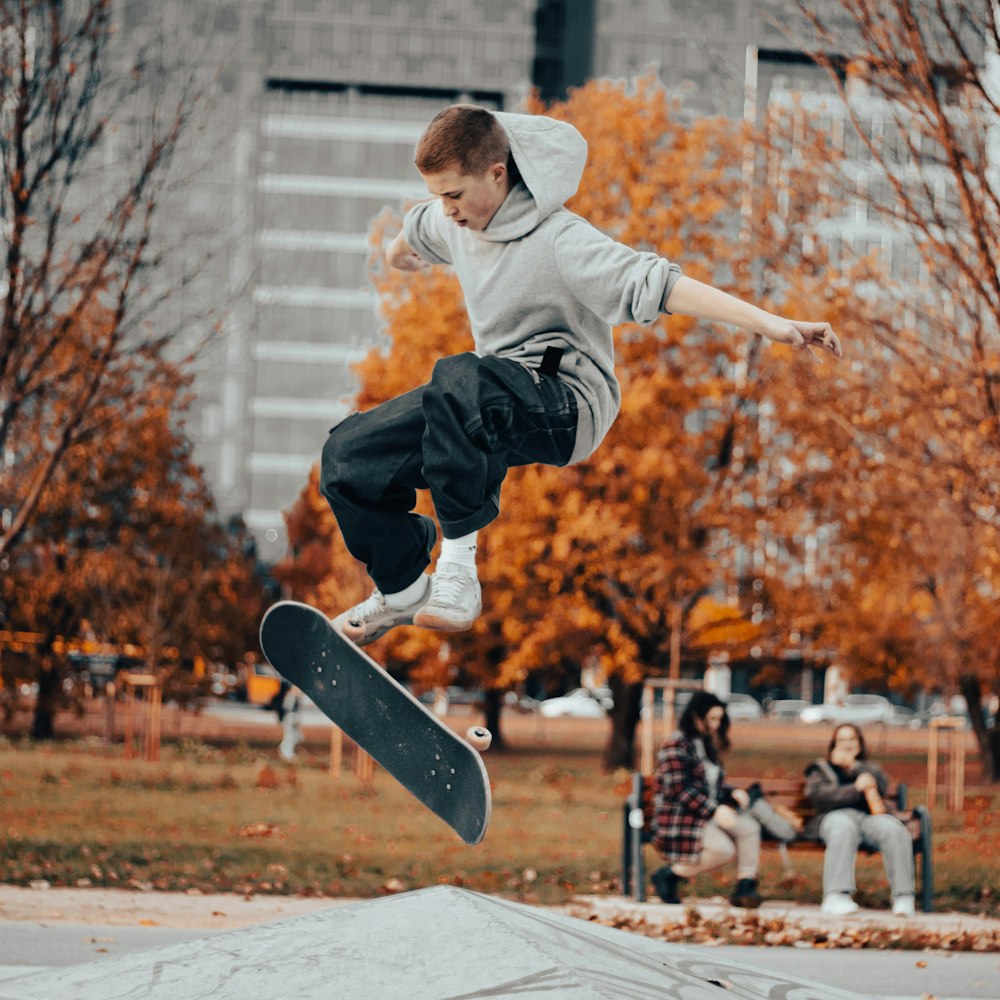 a man jumping in the air with a skateboard