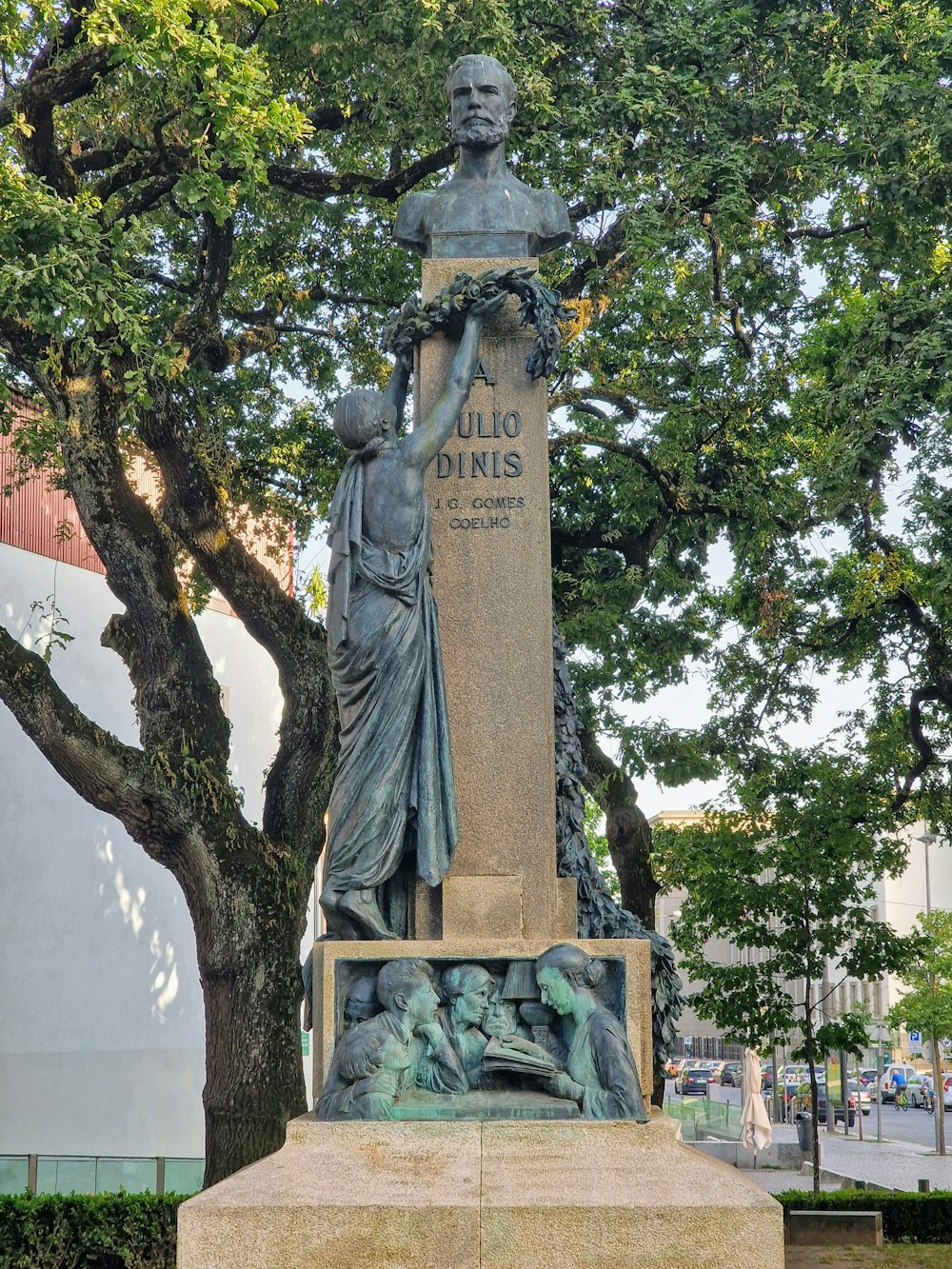 a statue of a person holding a staff