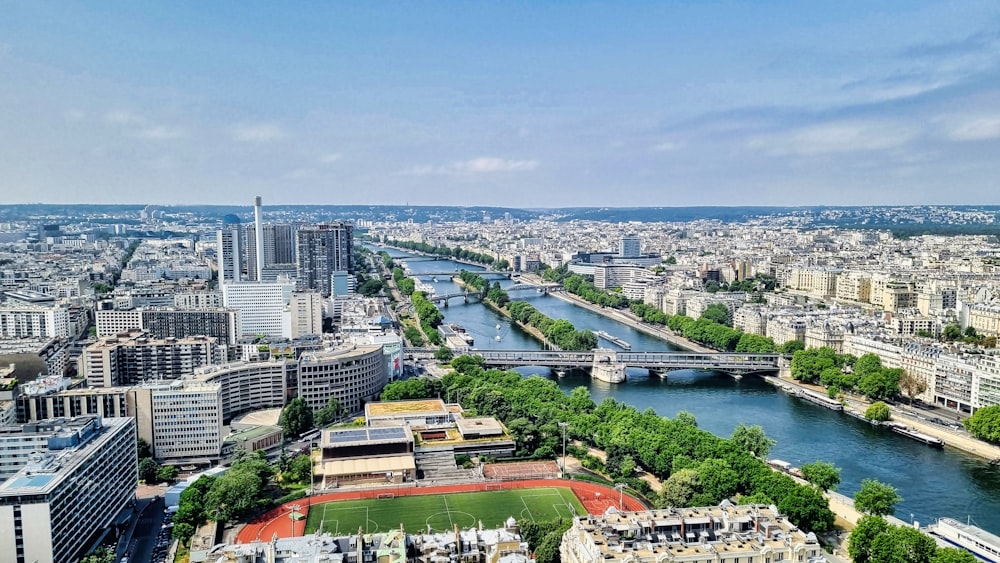 a river with a bridge and buildings