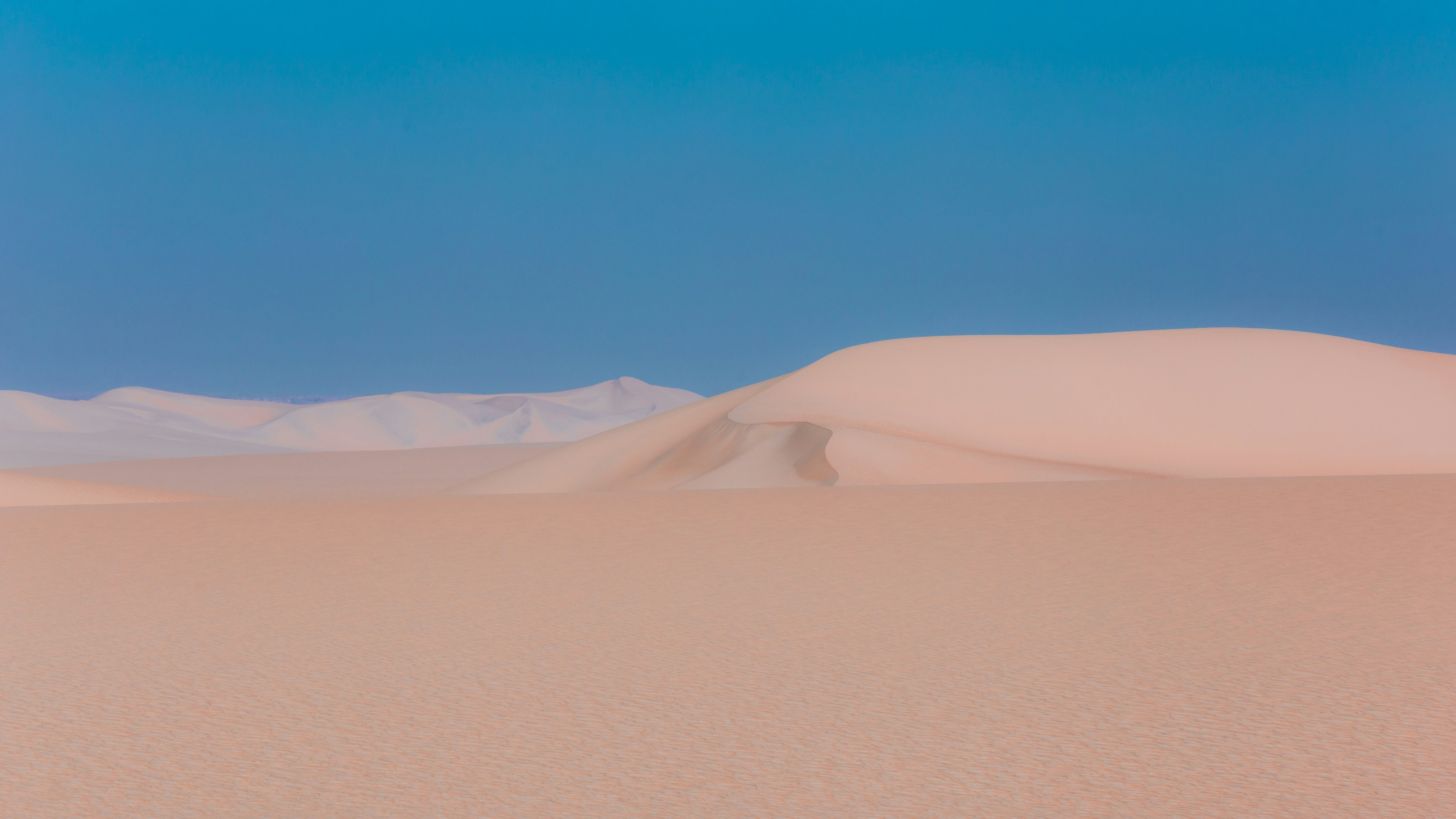 A desert landscape with sand dunes