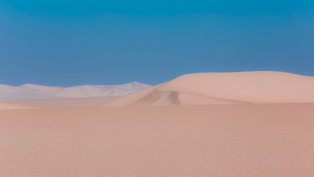 a desert landscape with sand dunes