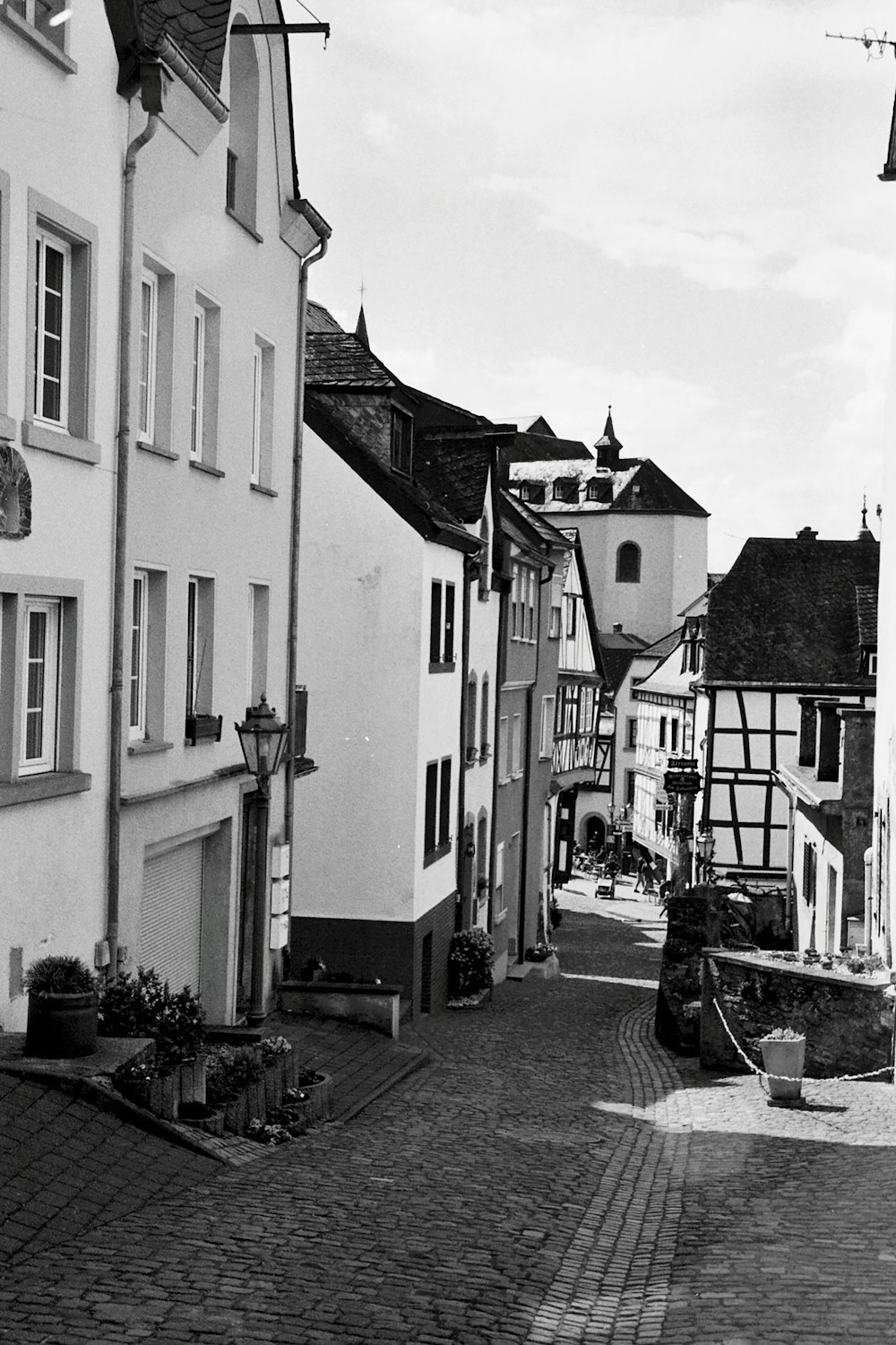 a cobblestone street with buildings on either side of it