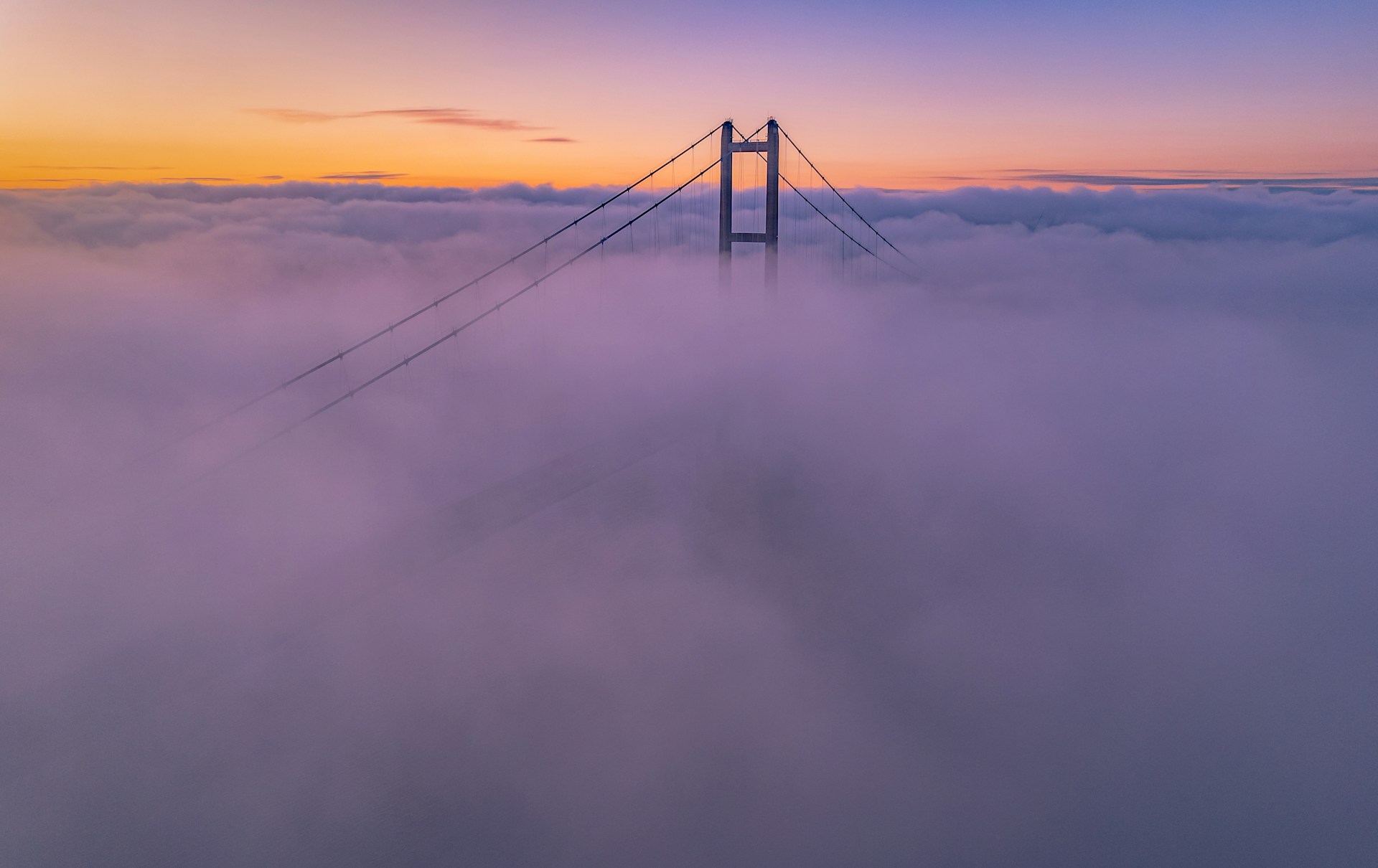 a bridge over the clouds