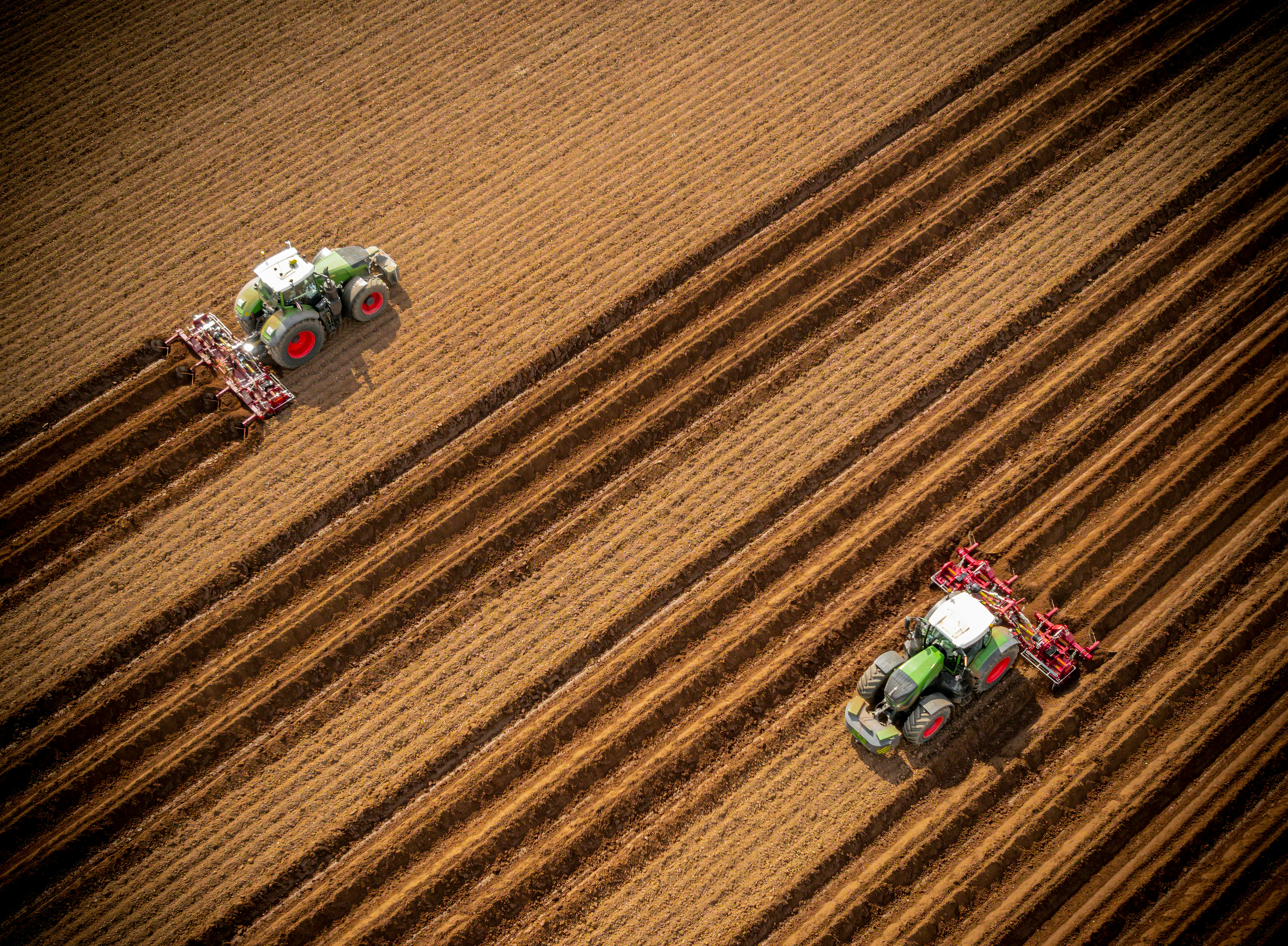 a group of people riding on a tractor in a field