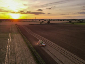 A Tractor seeding a field