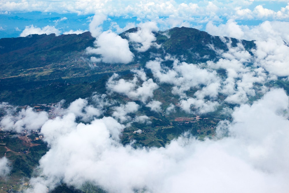 a plane flying over a mountain