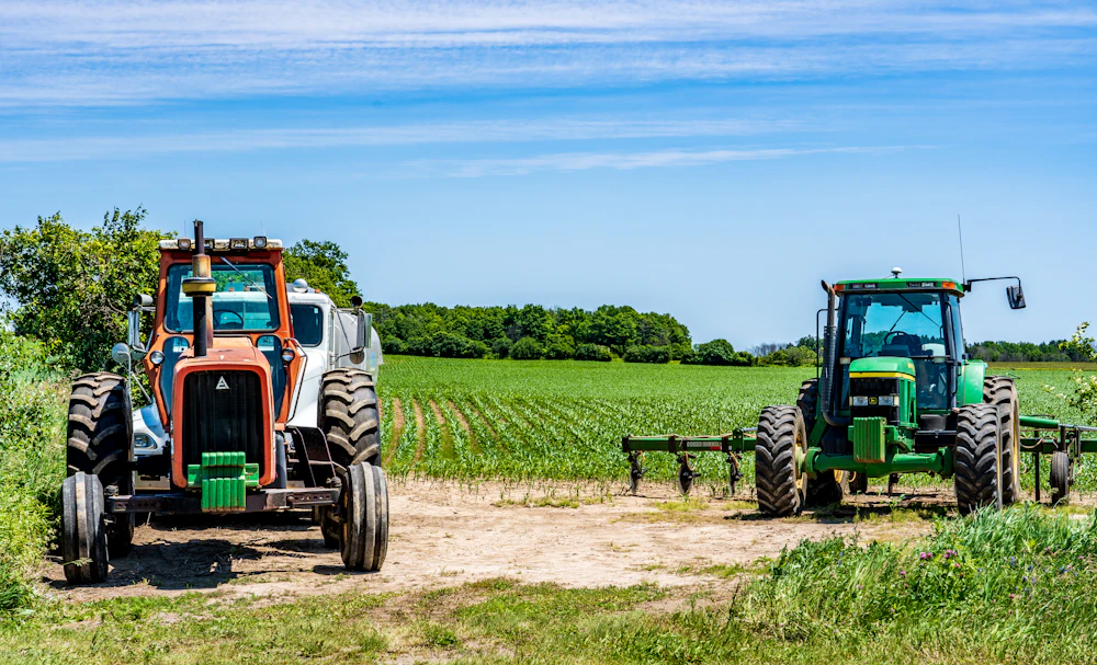 Farm tractors working in a field