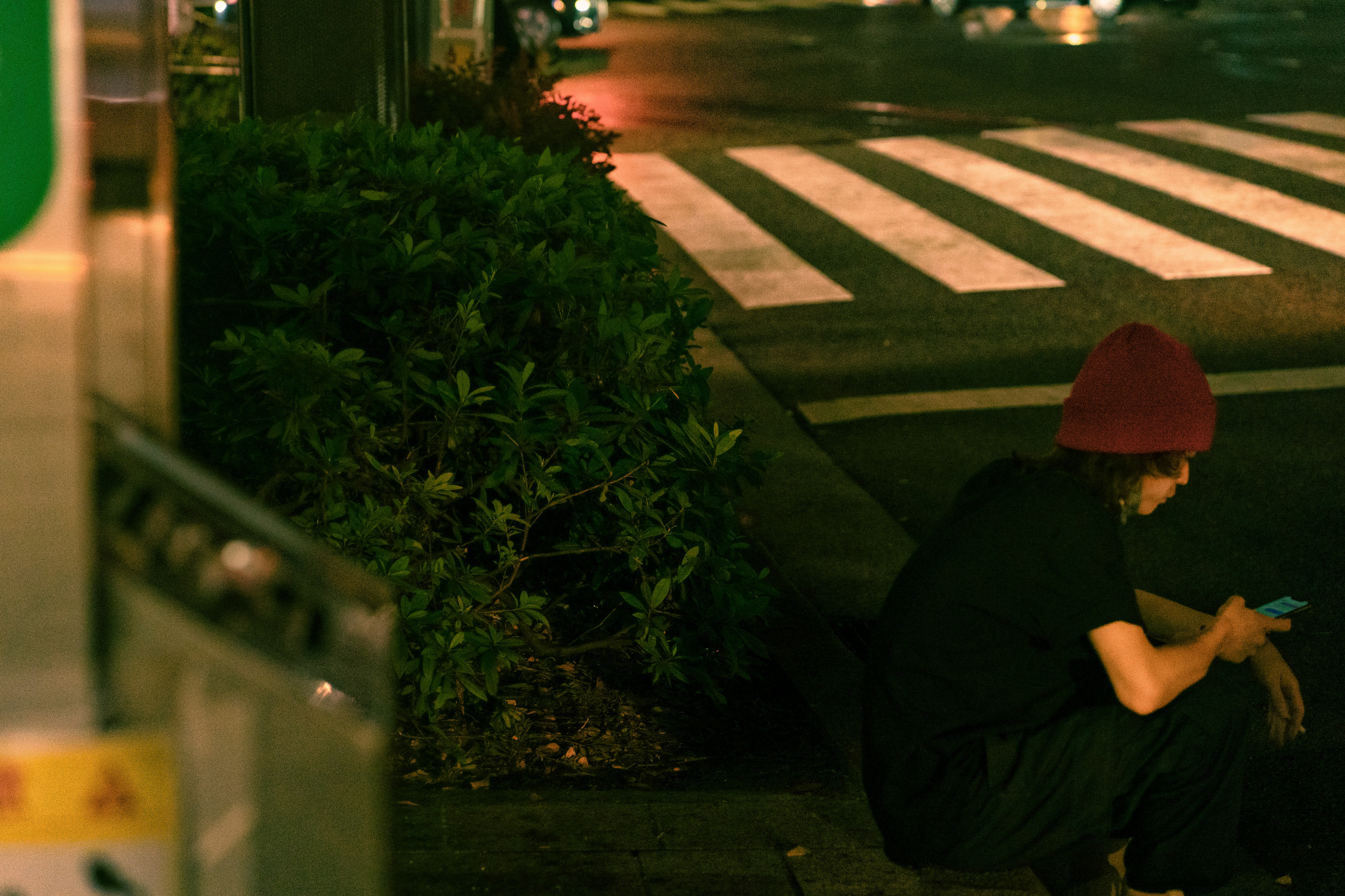Person demonstrating 'Drop, Cover, Hold On' under a sturdy table