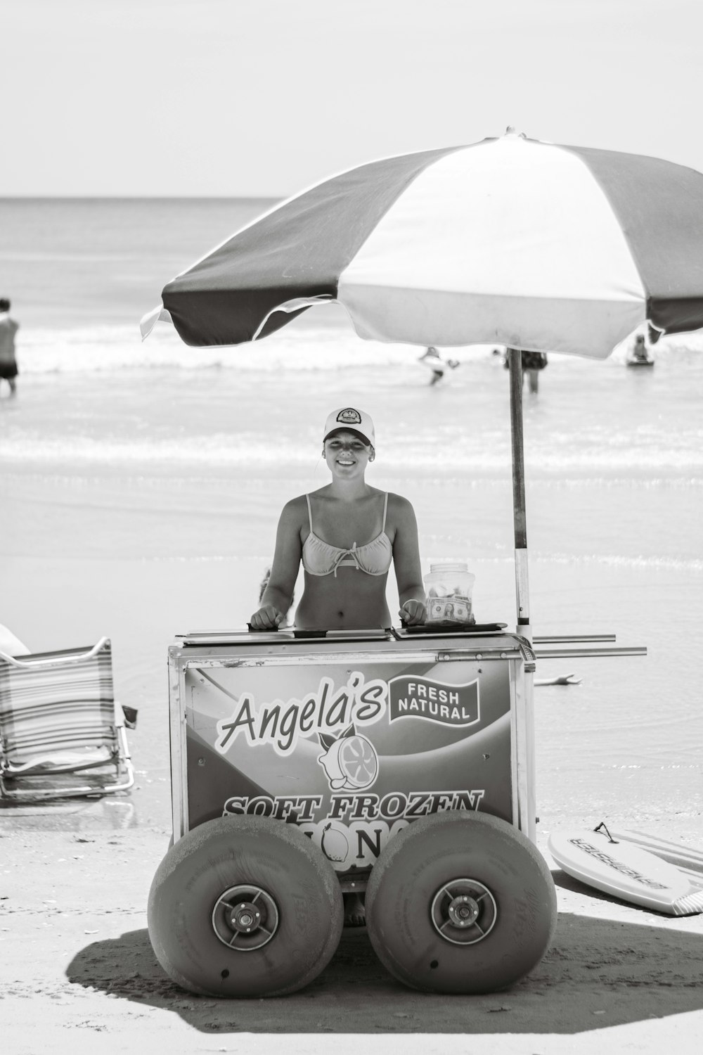 a person sitting in a cart on the beach