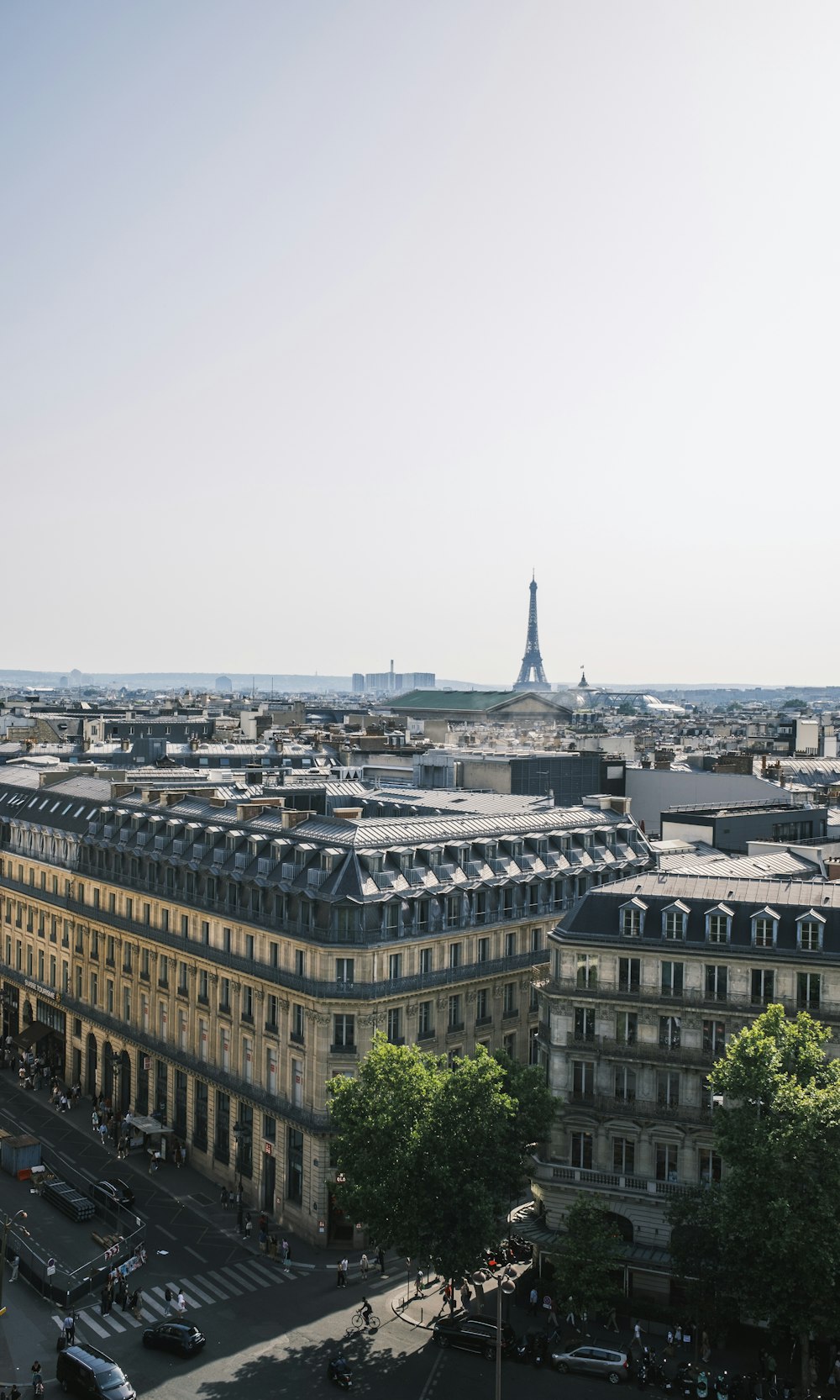 a large building with a tower in the distance