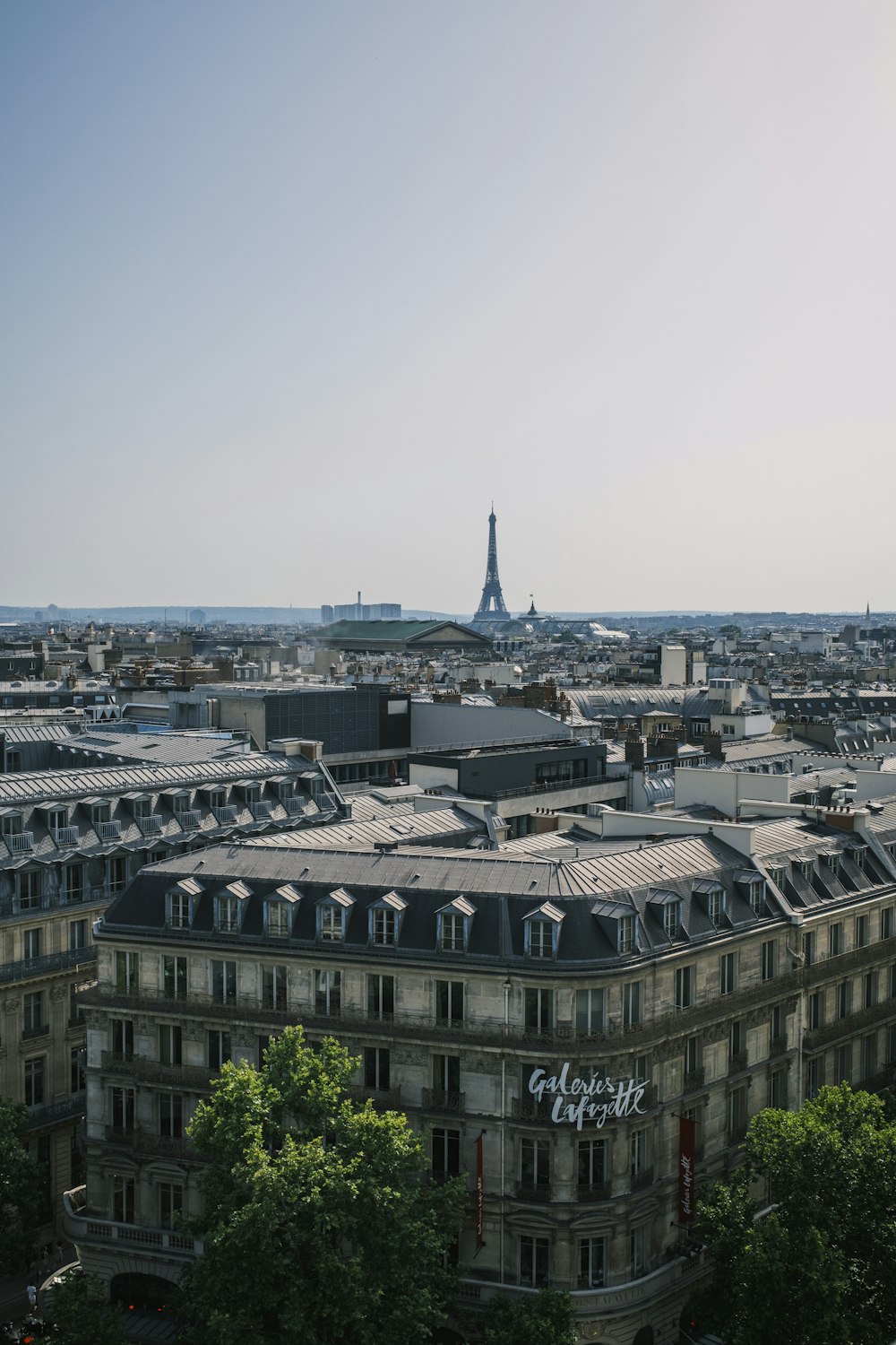 a large building with a tower in the distance