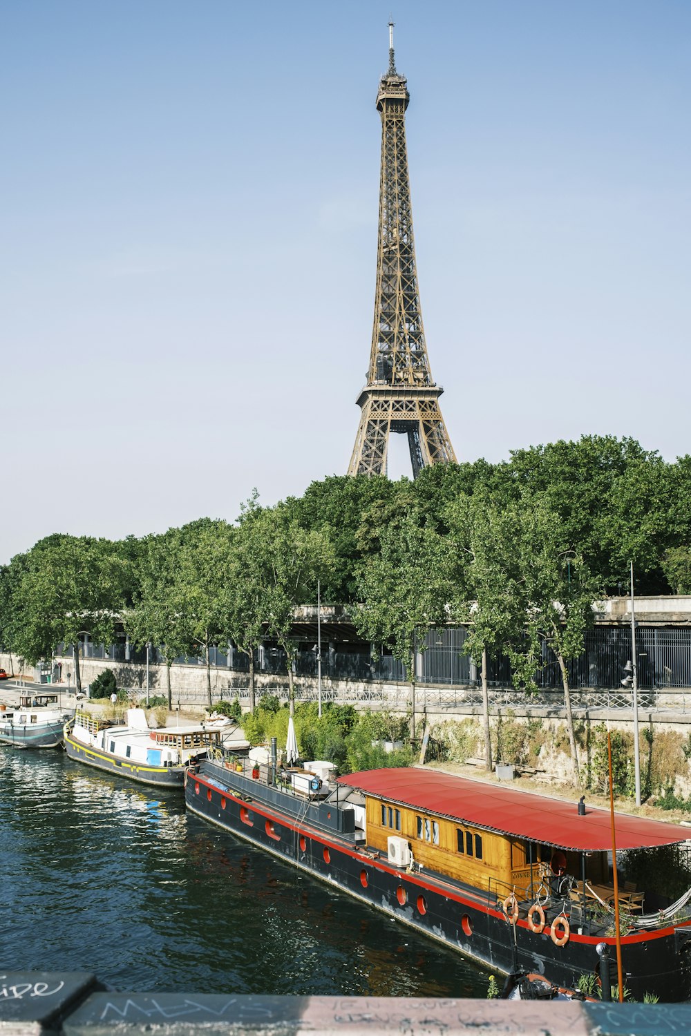 a boat in front of a tall metal tower