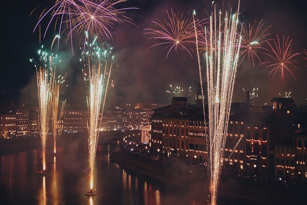 fireworks in the sky over water