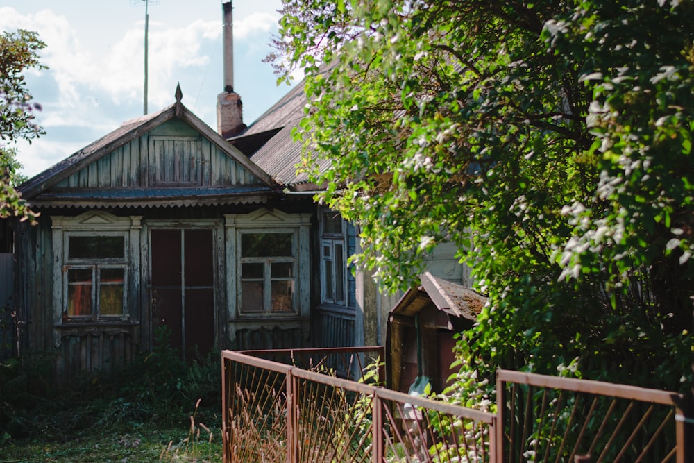 a house with a fence in front of it