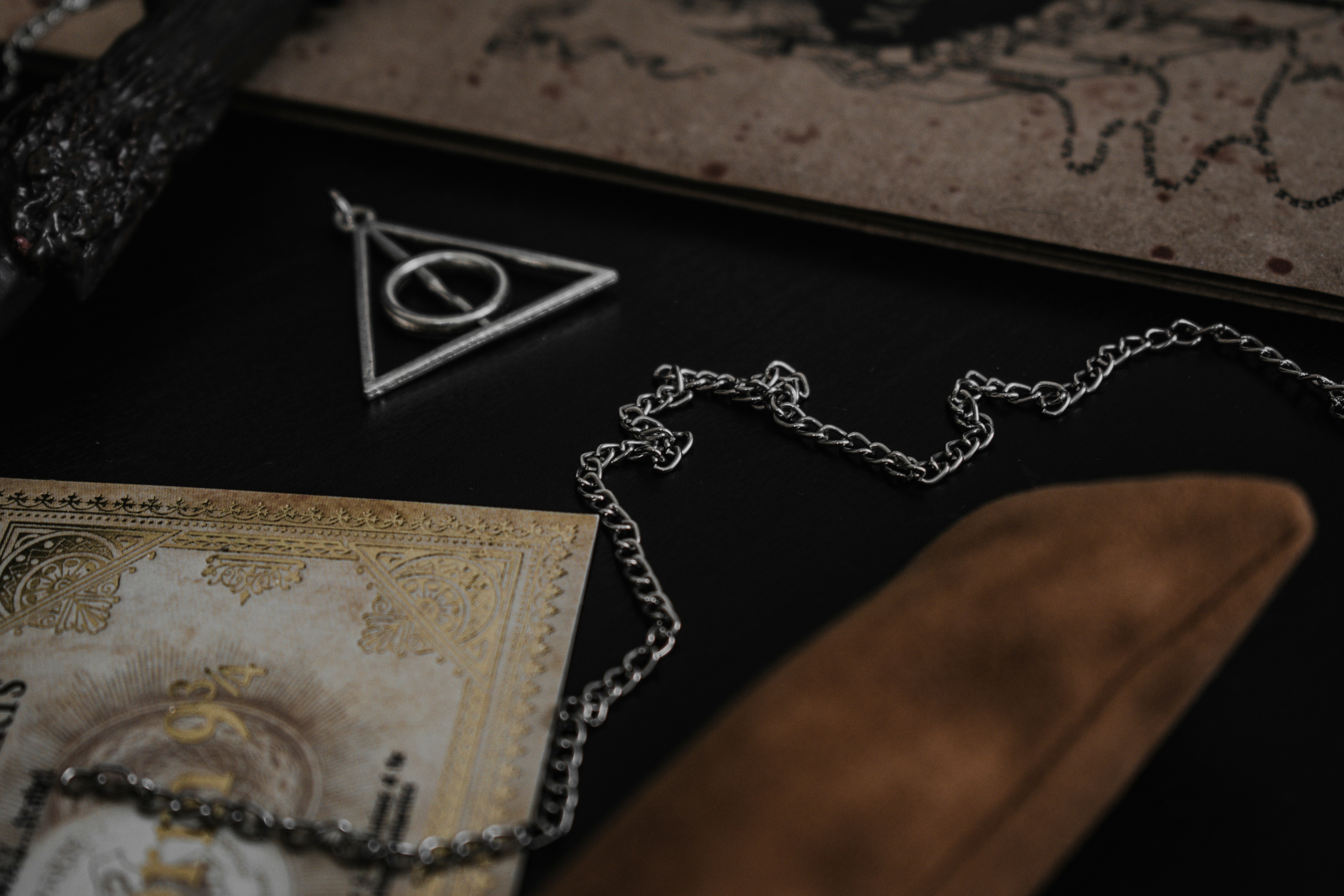 a gold ring on a black leather wallet