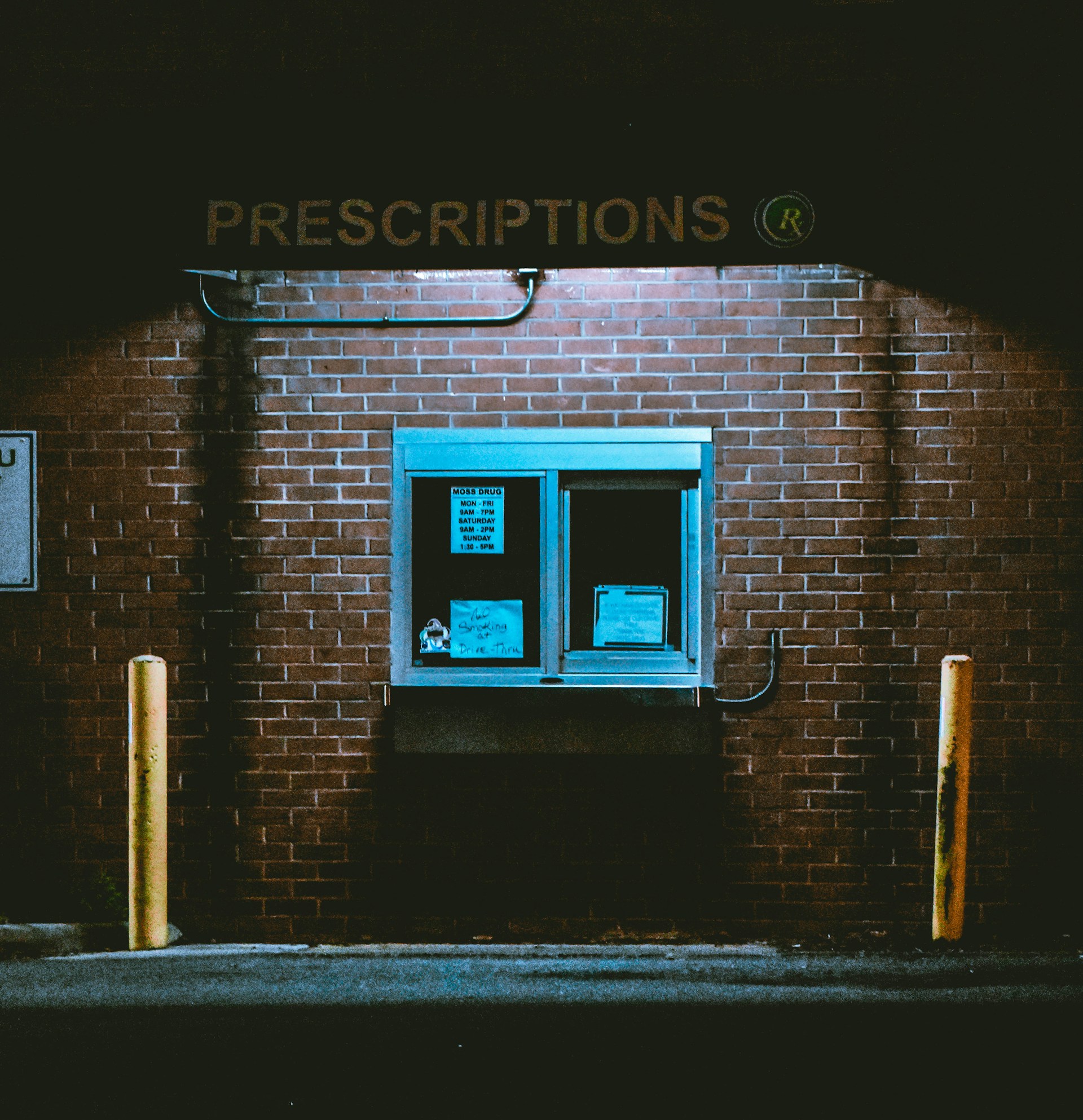a brick building with a sign on it