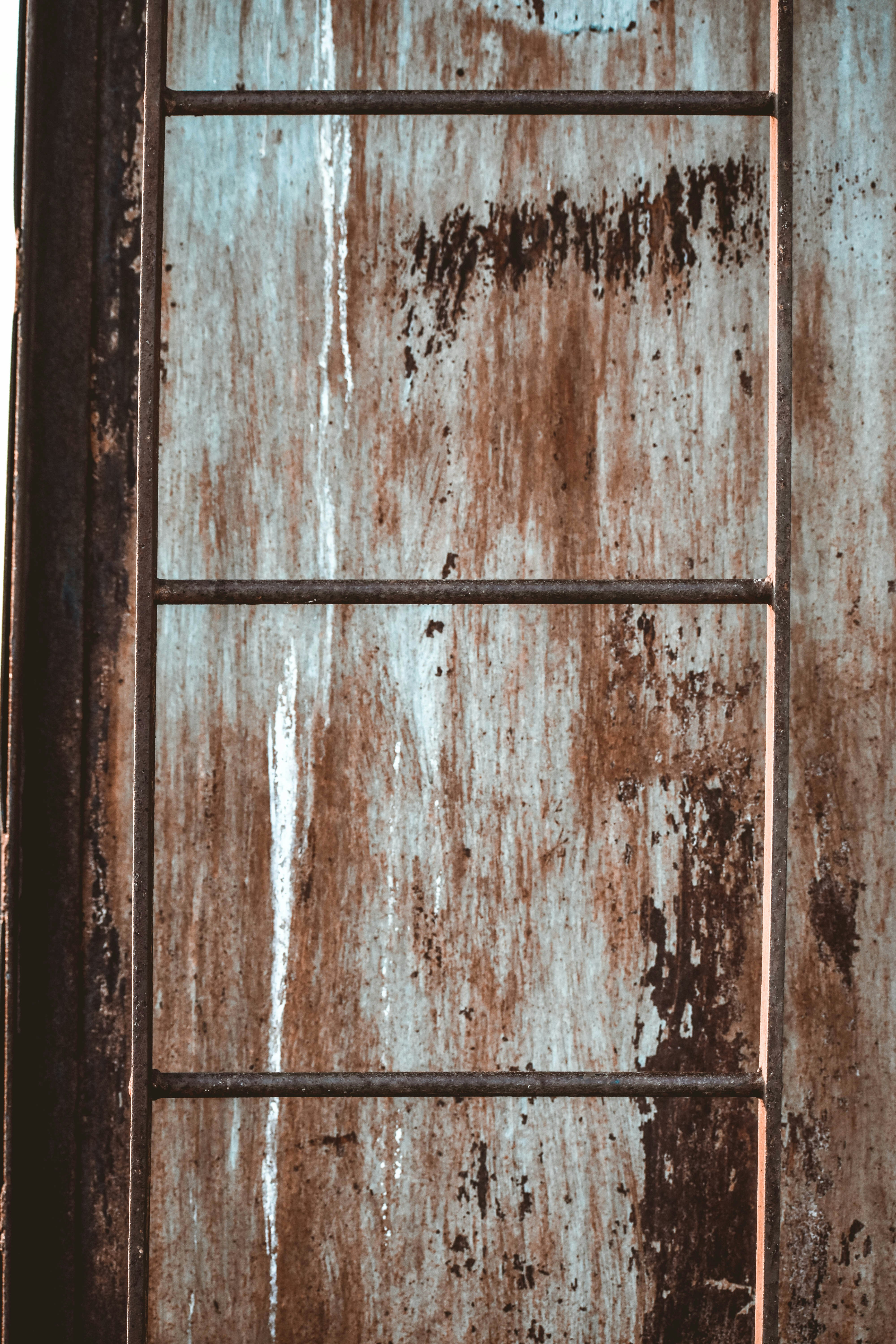 Rusty, forgotten ladder on the top of a tower in the abandoned Stanley mill.