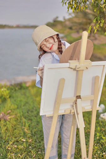 a girl painting a picture