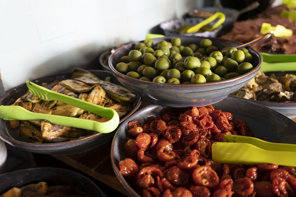 a group of bowls with food in it