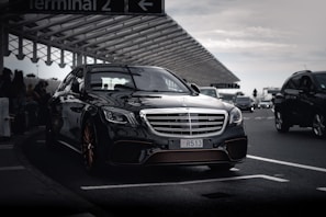a black car parked in a parking lot