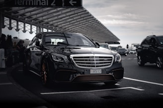 a black car parked in a parking lot
