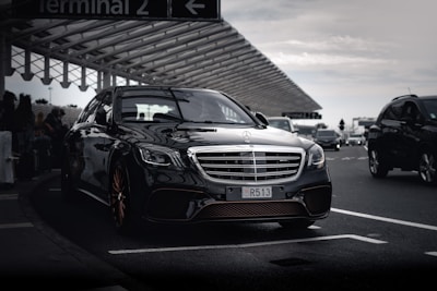 a black car parked in a parking lot